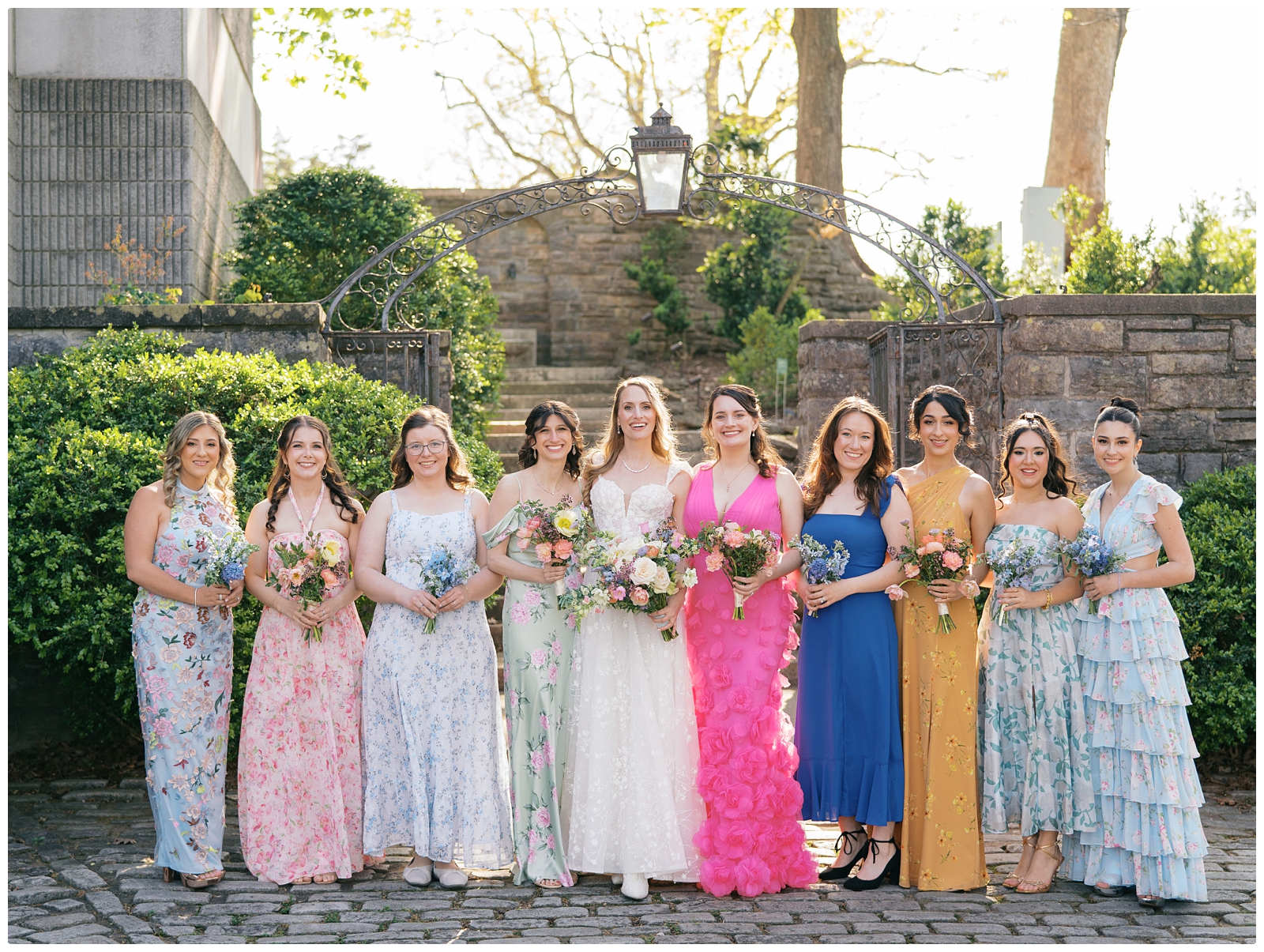 bride and bridesmaids wearing colorful dresses at Cheekwood Nashville wedding