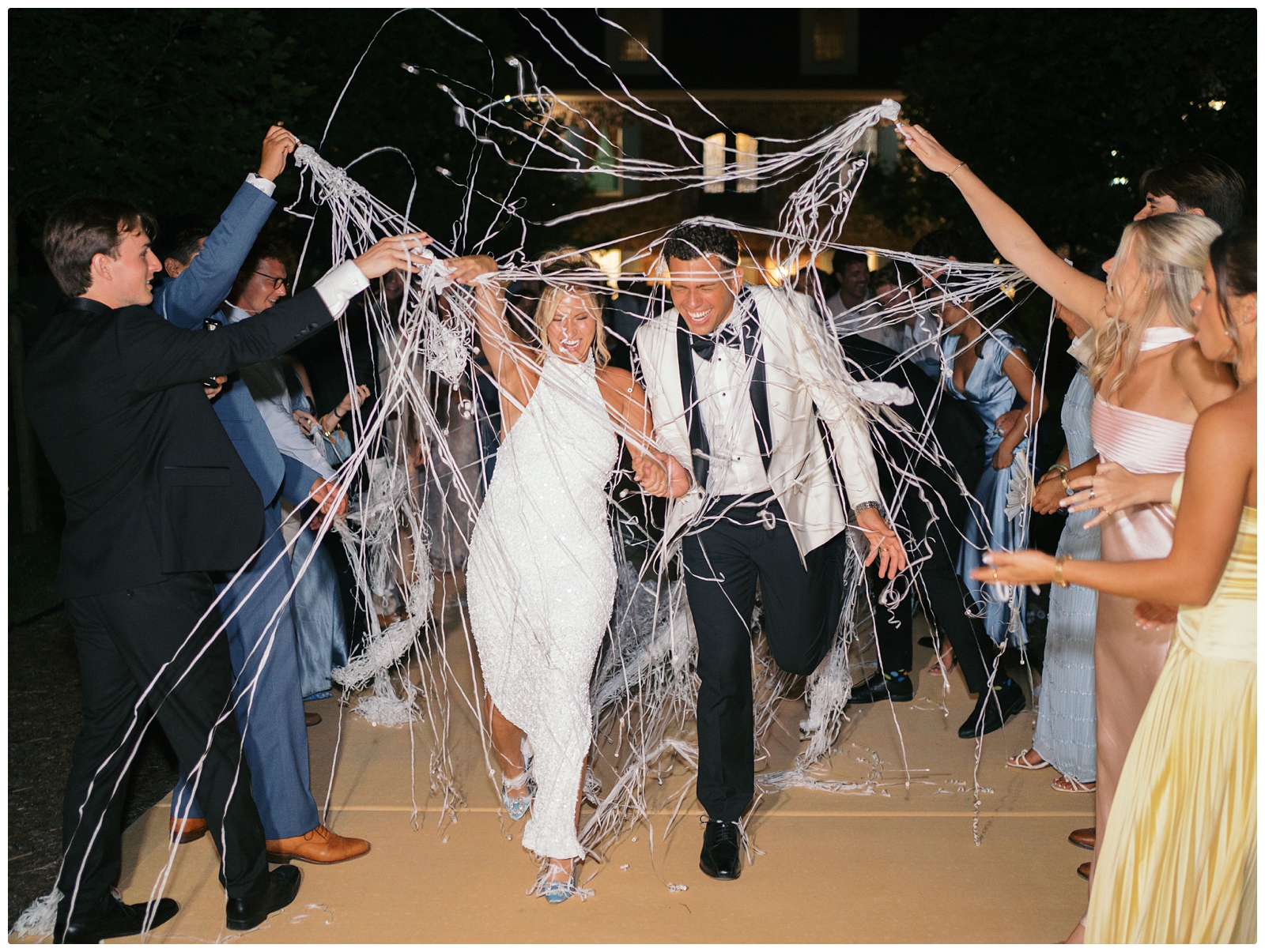bride and groom streamer exit at Blackberry ridge wedding