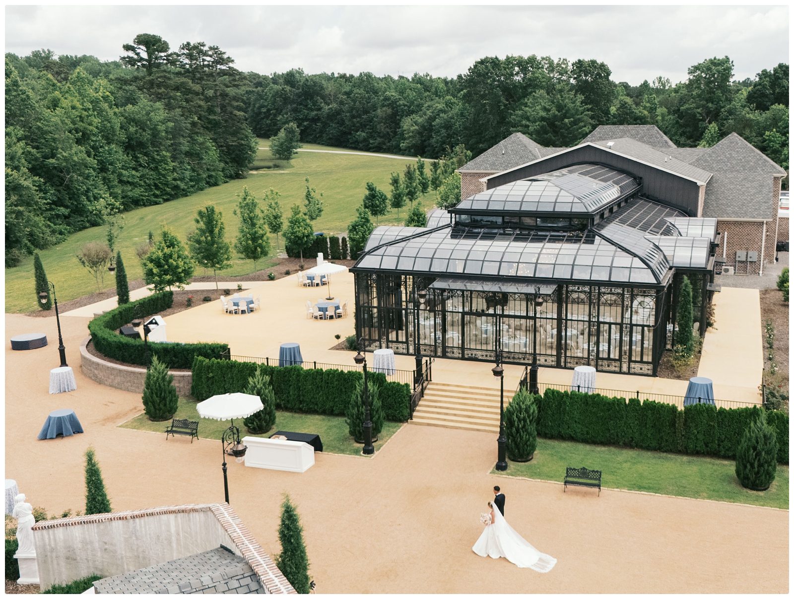 drone photo of bride and groom walking at their Blackberry ridge wedding