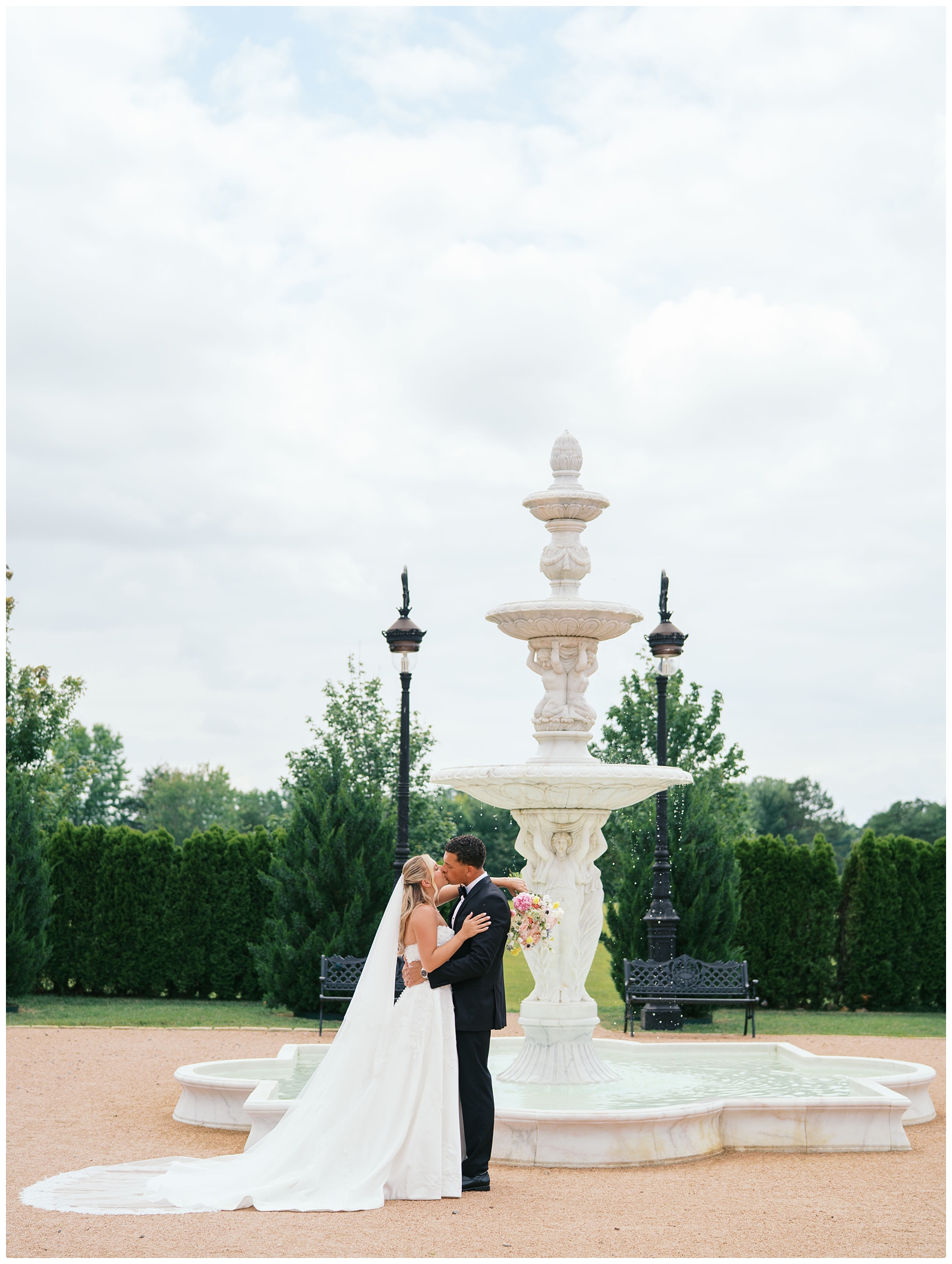 Blackberry ridge wedding photo of bride and groom by fountain