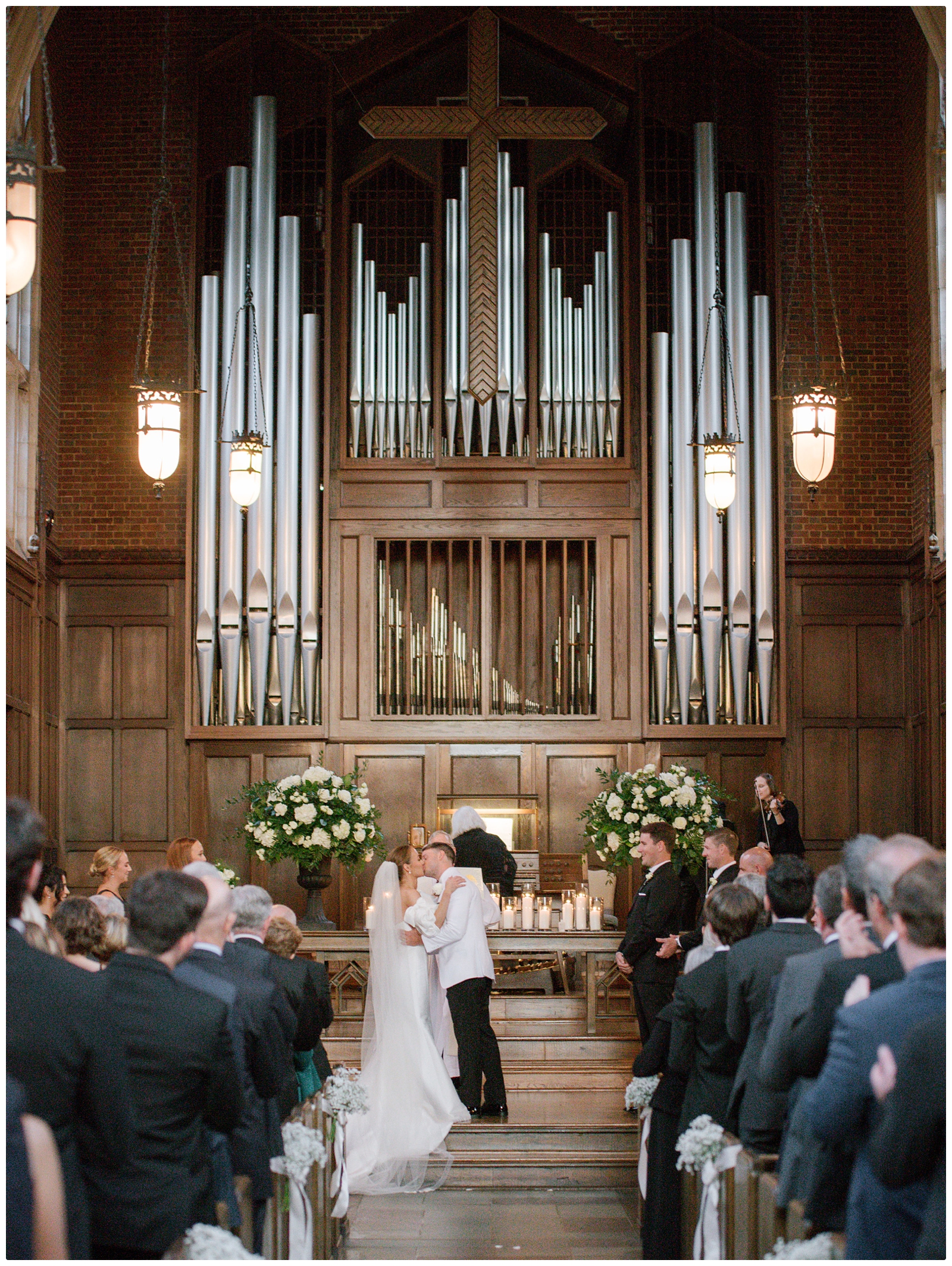 bride and groom first kiss during Scarritt bennett chapel wedding